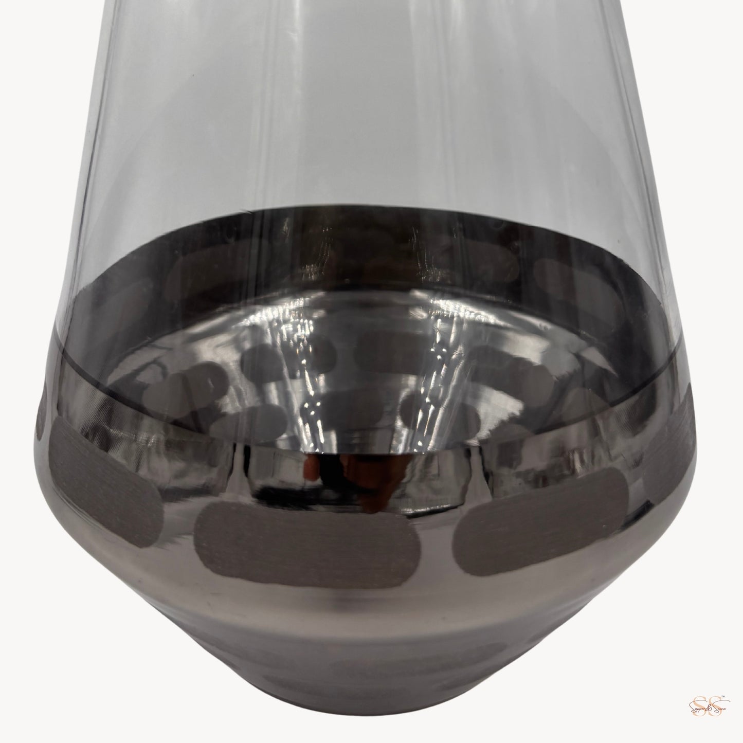 sleek grey-tinted glass vase featuring a reflective metallic rim and dotted base design by Supper and Scene.