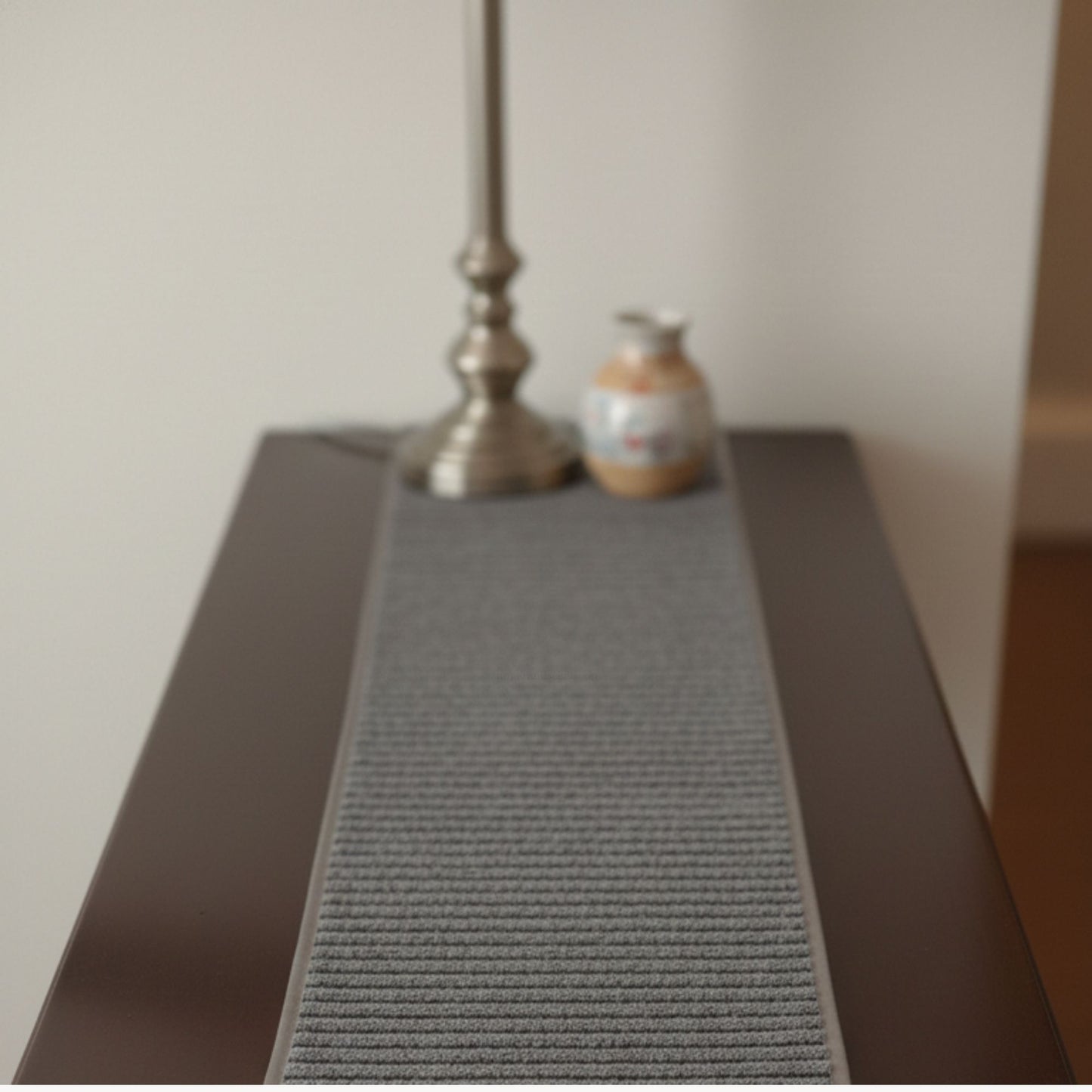 black table runner on console