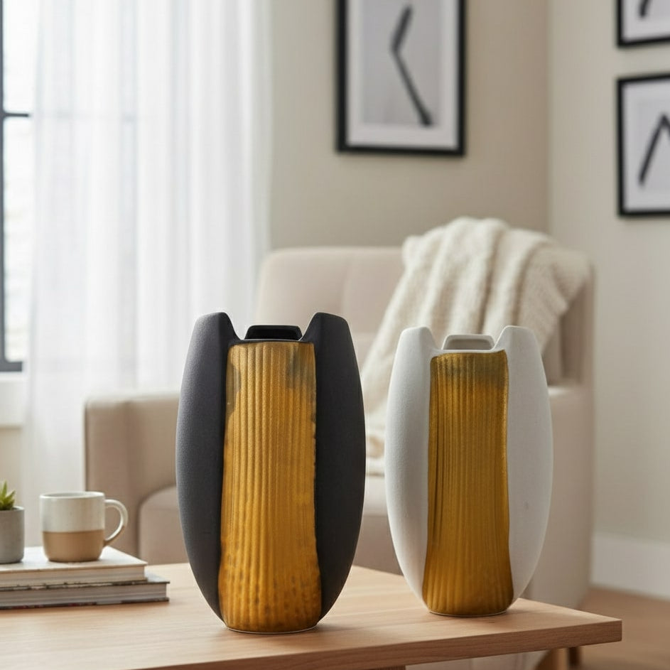 Two decorative vases on a table in a living room setting.