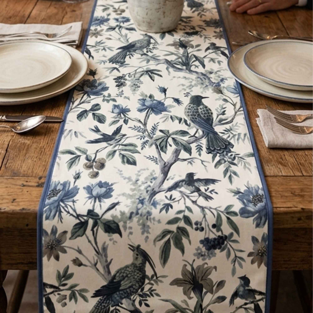 Blue floral printed long table runner styled on a dining table by Supper & Scene.