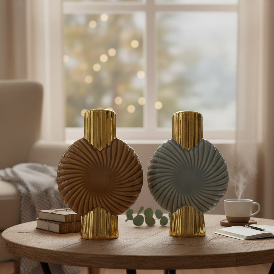 Two decorative vases on a wooden table with a blurred background
