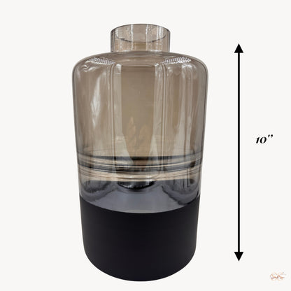 Full front view of a 10-inch smoked-glass vase with a cylindrical shape and black matte base, by Supper and Scene.