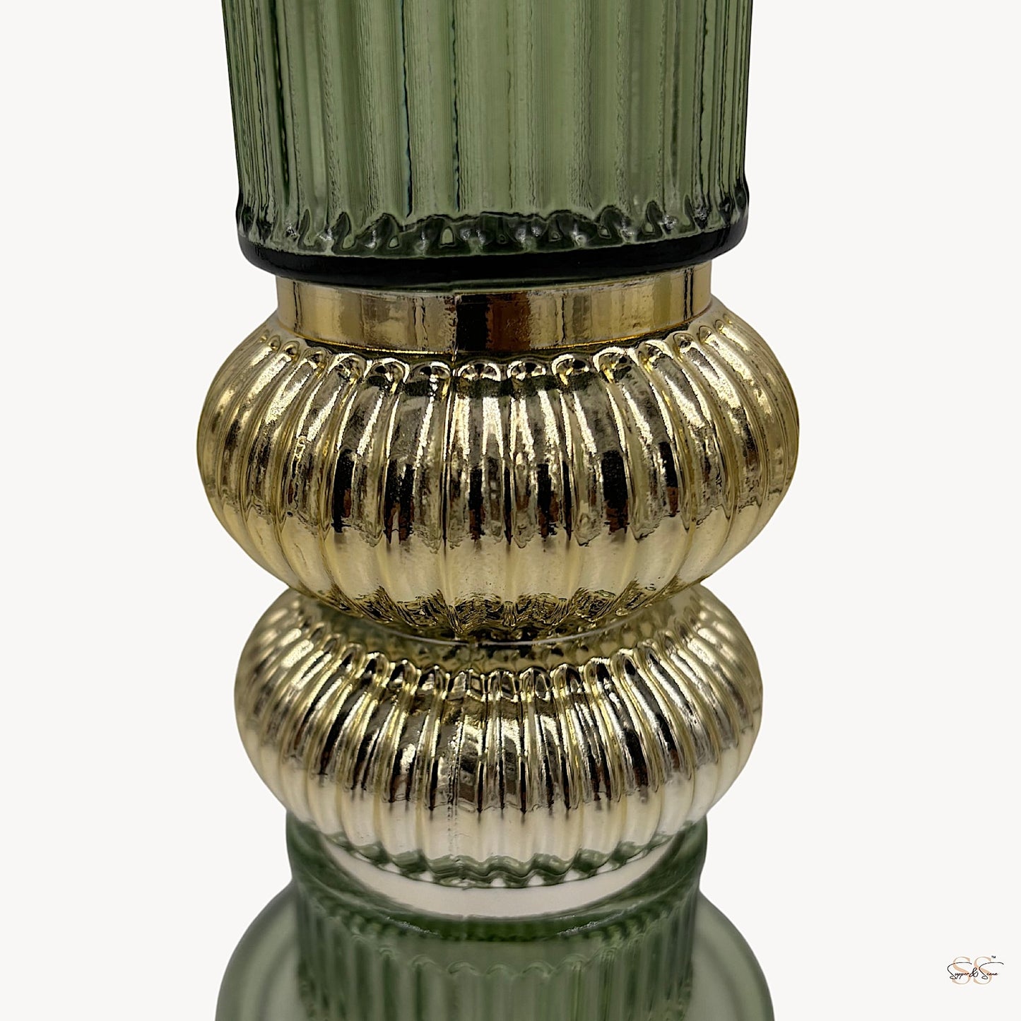 Green ribbed glass vase with gold textured accents by Supper & Scene.