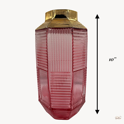 Tall pink ribbed glass vase with a gold-plated top, measuring 10 inches in height, displayed against a plain background by Supper & Scene.