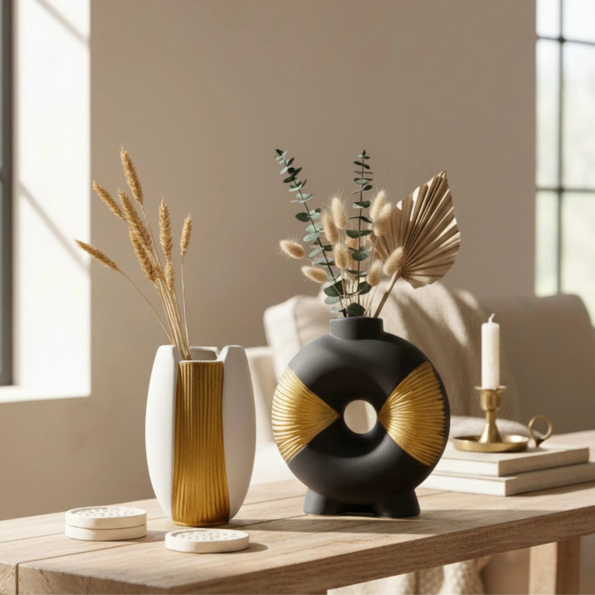 ceramic vases with plants on a wooden table in a bright room.