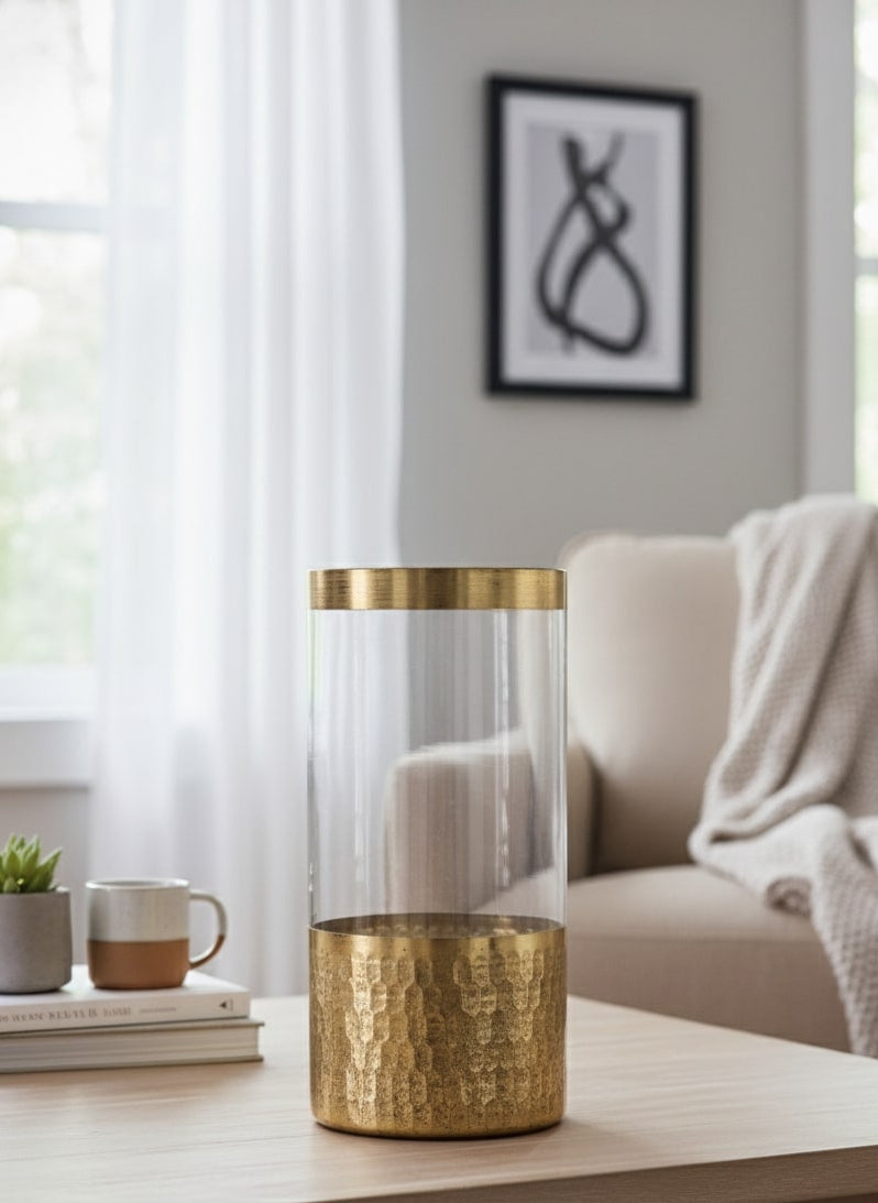 Gold glass vase on a coffee table in a living room setting by supper and scene