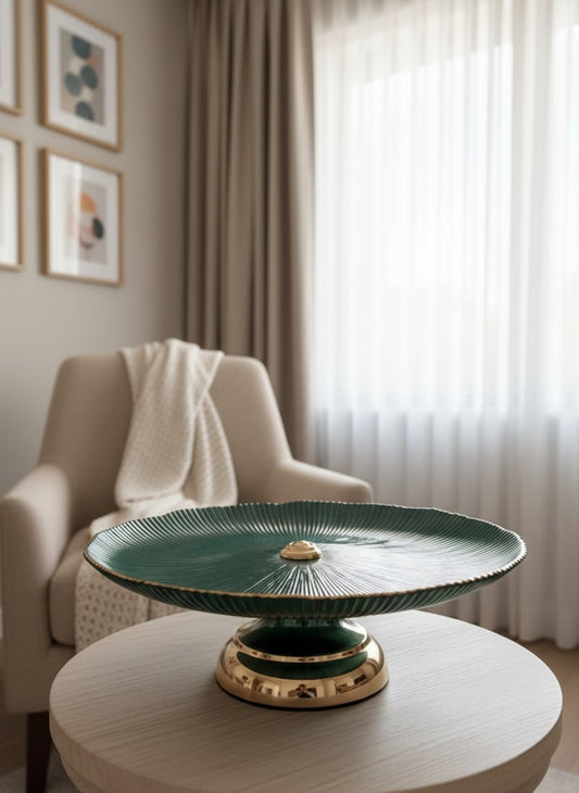 decorative green and gold pedestal table in a living room setting by supper and scene