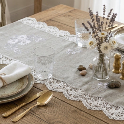 Grey embroidered fabric table runner for elegant dining table styling by Supper & Scene.