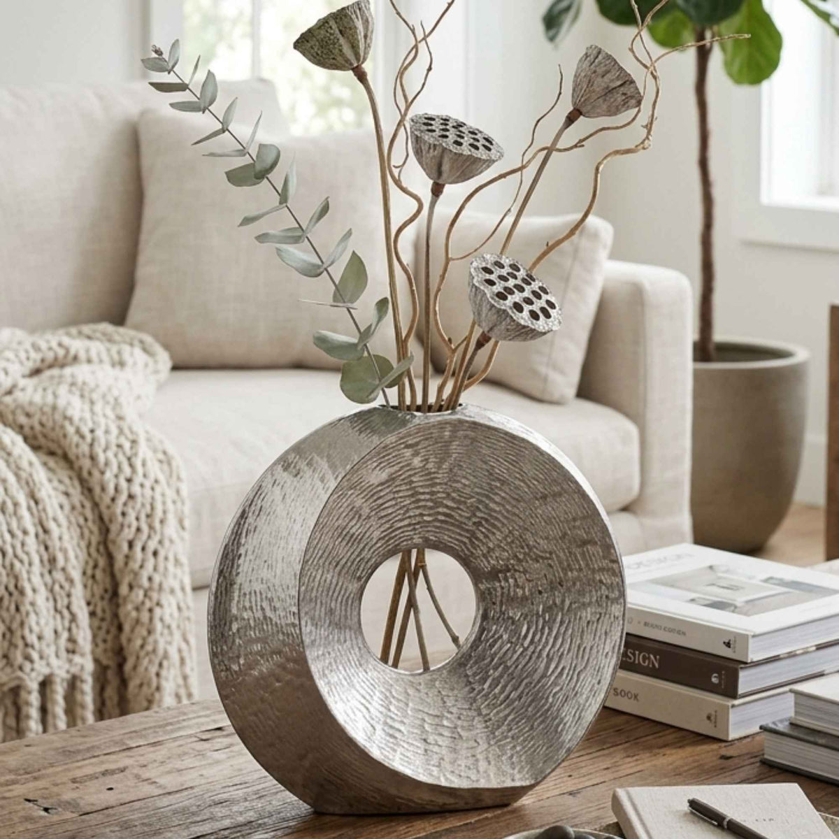 German silver metallic showpiece vase styled as a home decor accent by Supper & Scene.