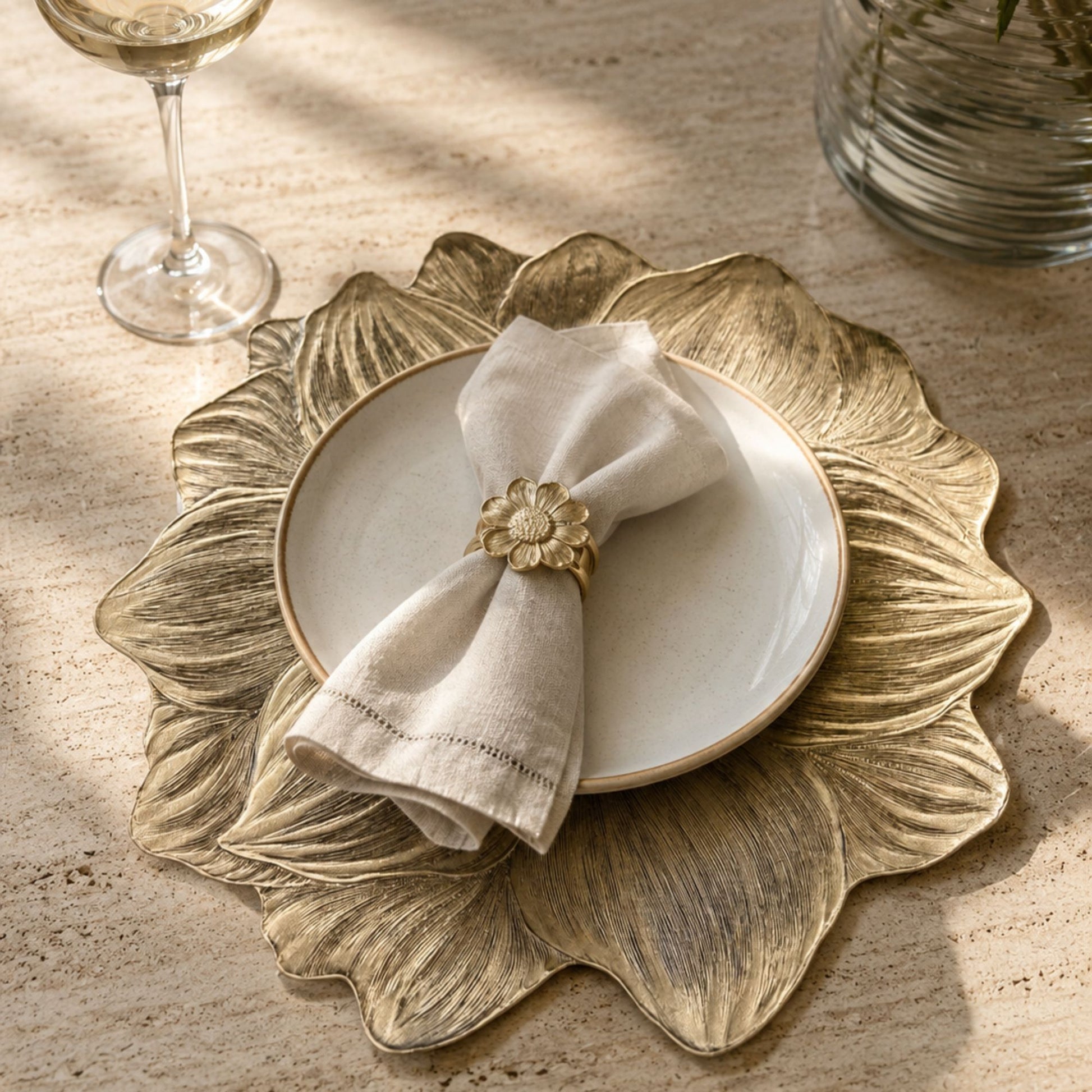 Metallic gold flower-shaped side mat for dining table place settings by Supper & Scene.
