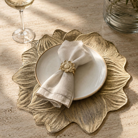 Metallic gold flower-shaped side mat for dining table place settings by Supper & Scene.