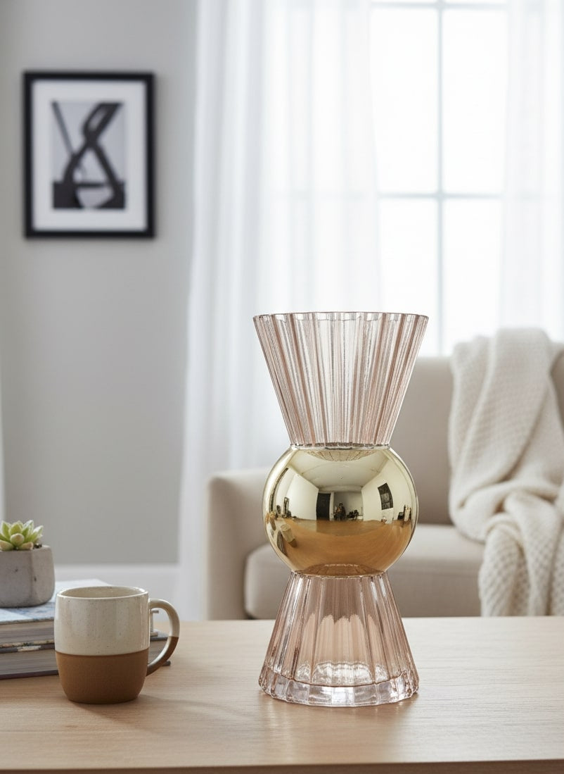 Decorative vase with gold and pink design on a wooden surface in a living room setting by supper and scene