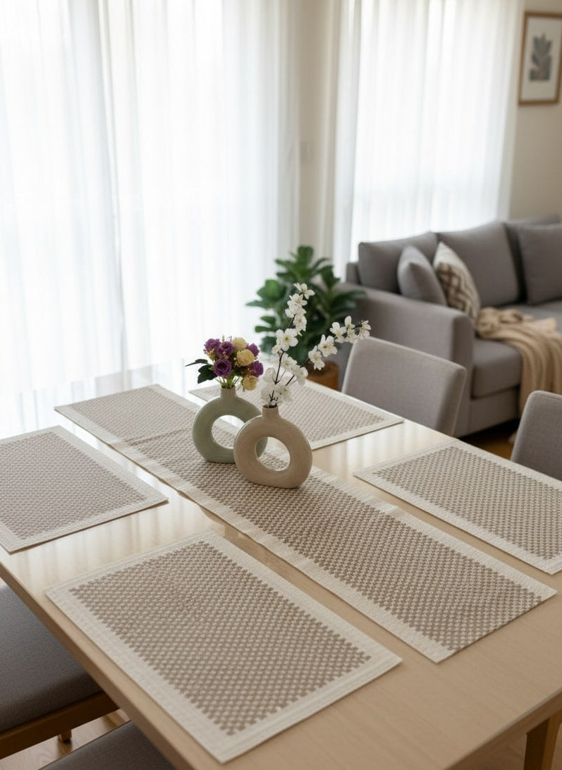 Dining table set for 6 with placemats and vases in a living room by supper and scene