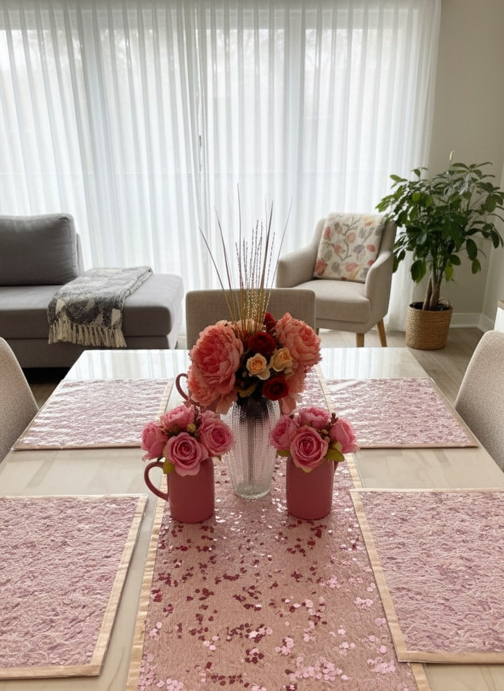Dining table set of 6 with pink floral arrangements, table runner, and placemats in a living room by supper and scene.