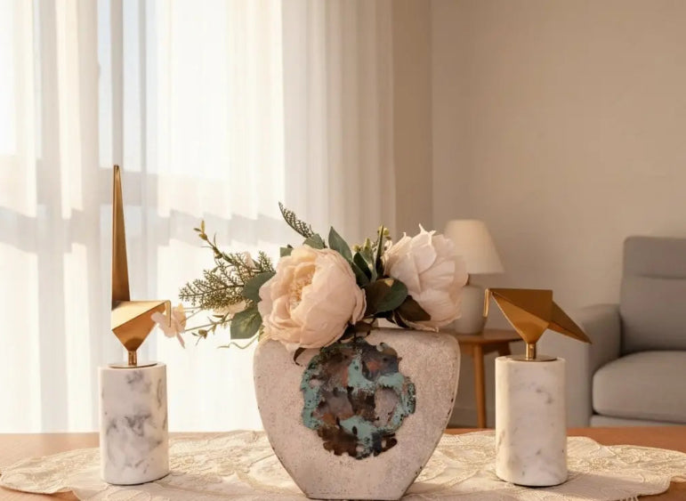 Decorative vase with flowers on a table in a living room setting