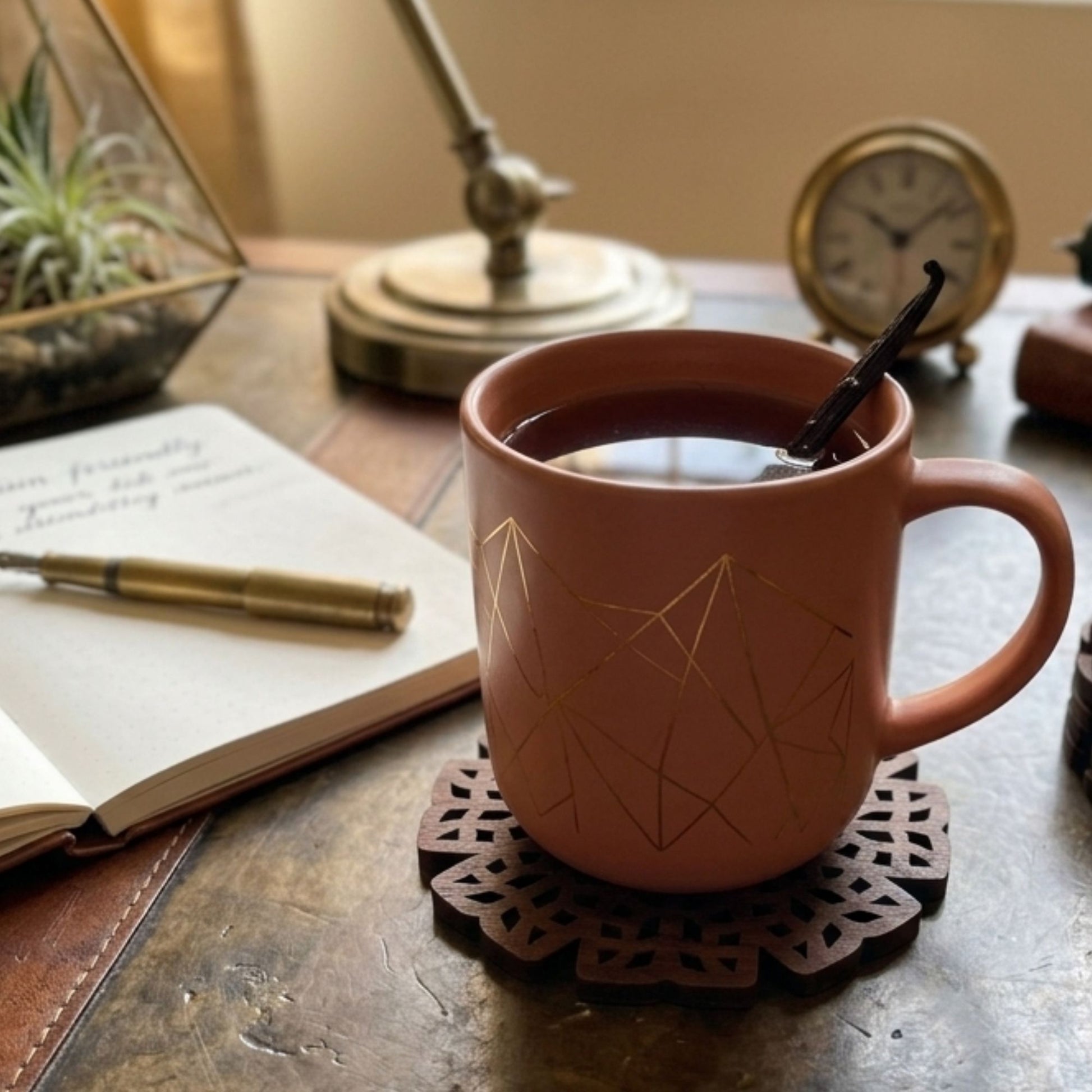 Brown wooden round cutwork coaster for hot beverage cups by Supper & Scene.