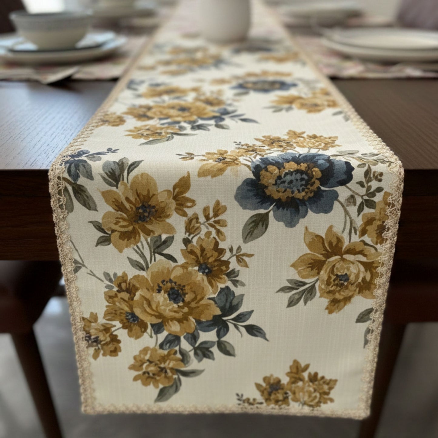 Floral botanical dining table runner with mustard flowers styled with plates and wine glass